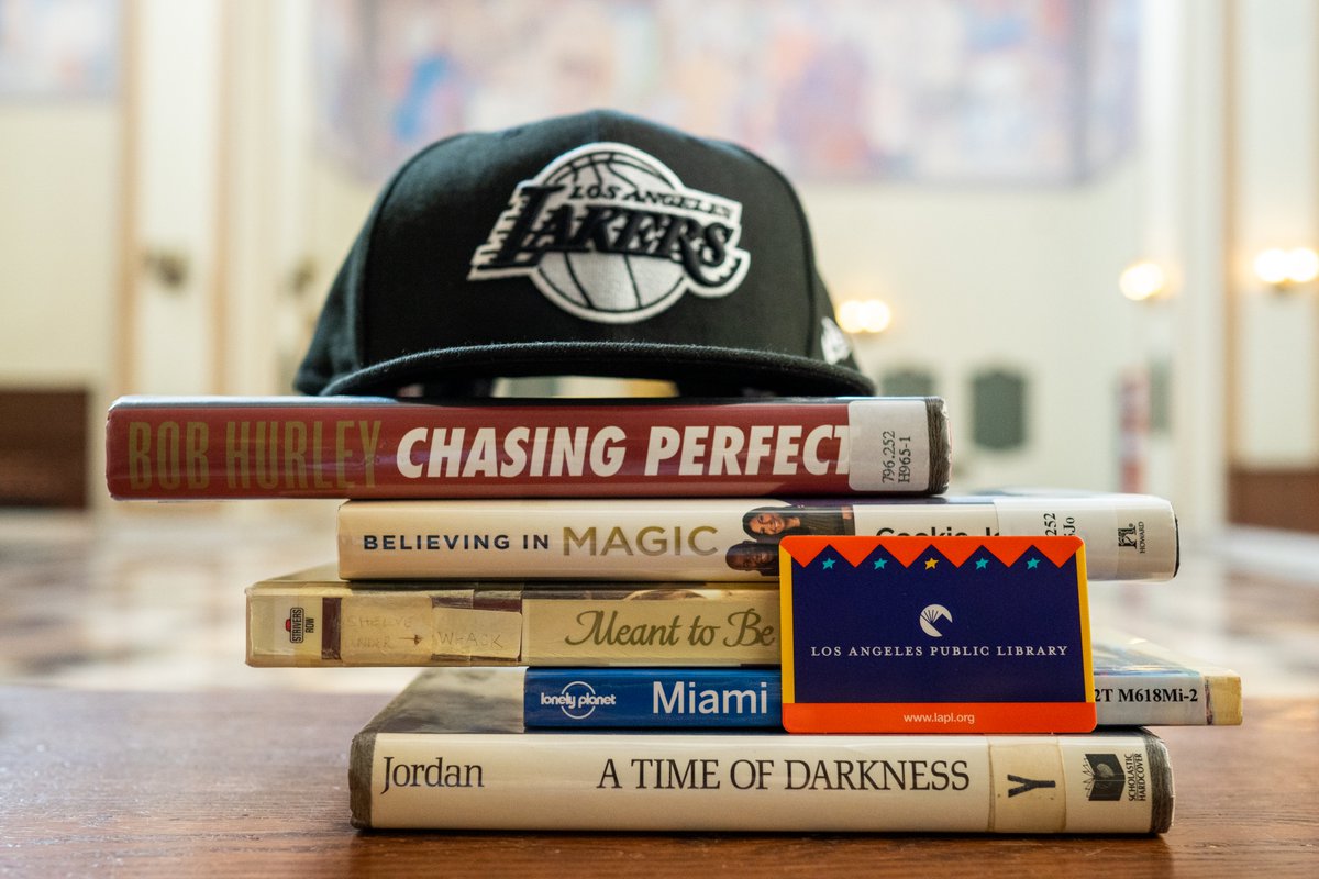 book stacked with titles chasing perfect believing in magic meant to be Miami a time of darkness