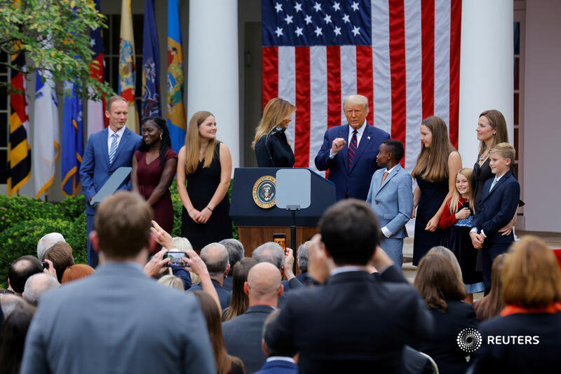 September 26: Trump poses with Supreme Court nominee Amy Coney Barrett and her family at the White House