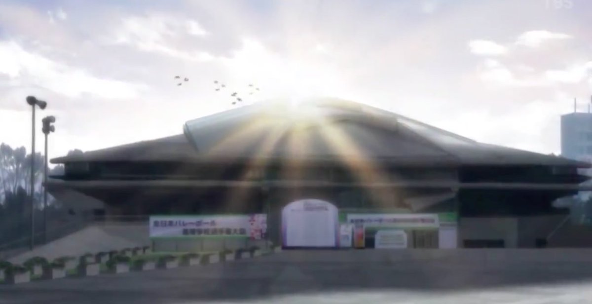The next shot is of the sun shining brightly behind the arena which transitions into the bright ceiling lights that line the roof of the arena. This is SUCH an important establishing shot.