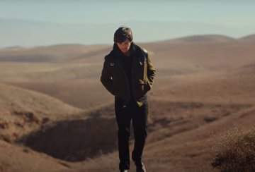 The MV: The beginning of the song is set in a barren desert, which reflects the themes of loneliness. The mirrors show him reflecting on his journey and the single wall is a call back to the title of his song and the album. His metaphors and imagery are quite on the nose.