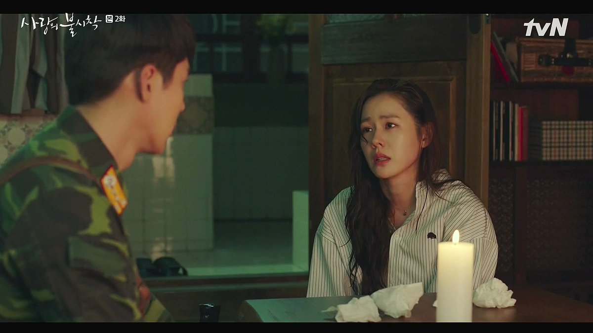 Episode 2: There's a power outage in NK. We see families all finding sources of light together: candles, lamps, secret batteries. But Seri has no one. She's alone and afraid in the dark, until RJH brings her a candle. It's symbolic of hope and comfort.