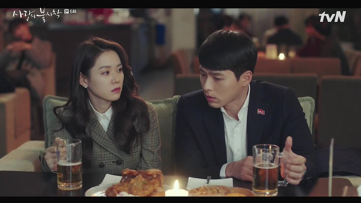 Episode 6: Pyongyang. Just before the first snowfall, the light goes out and the waiters bring candles. Seri and RJH both know that they care for each other, but they can't say it. The candle is a symbol of their longing, and also our hope that everything will be OK.