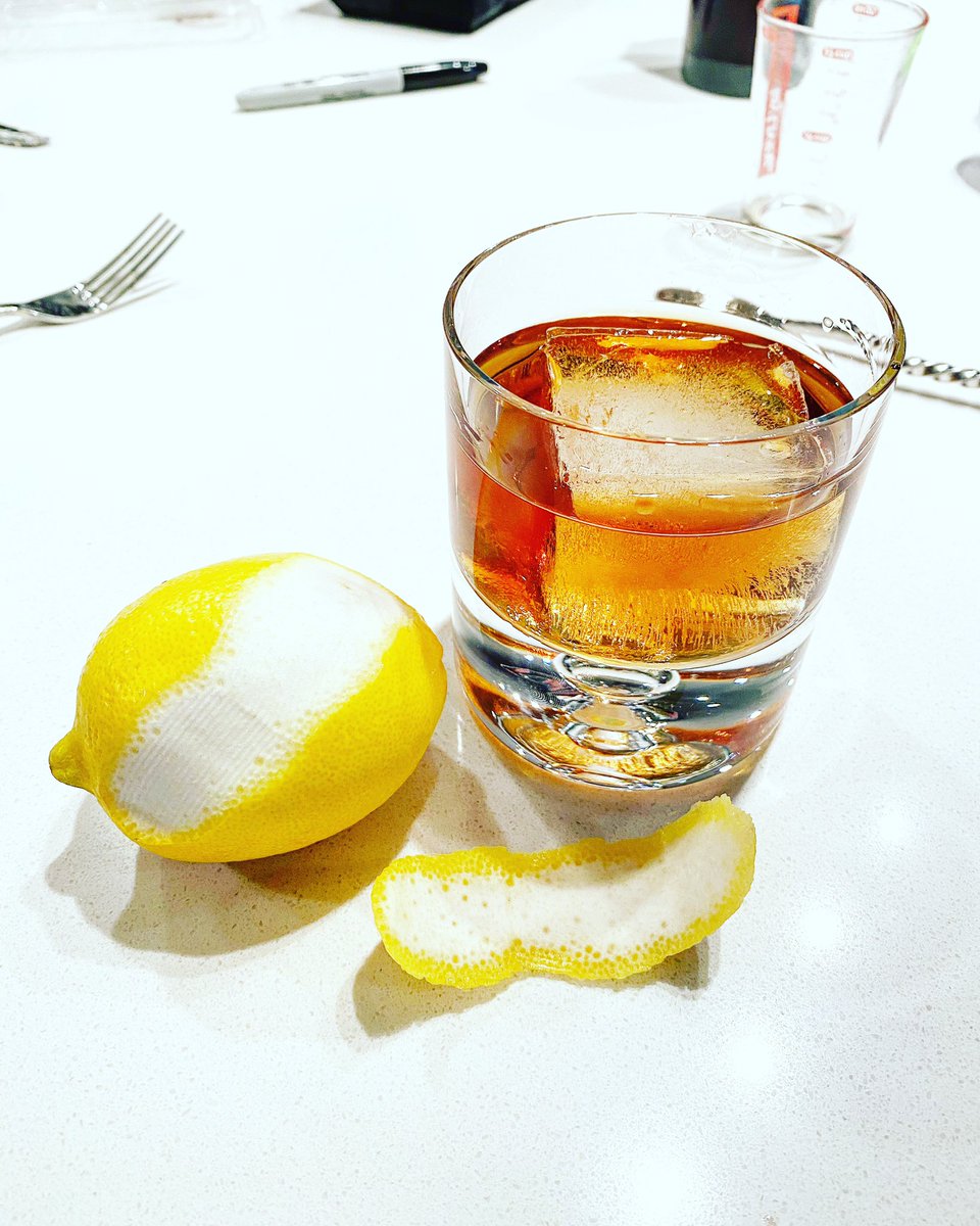 6. Take as big of a rip of a lemon peel as you can get. Express it over the top of your drink. Basically that just means squeeze it yellow side down over the top of your drink. Drop the peel in the drink and do a single quick little stir with it.