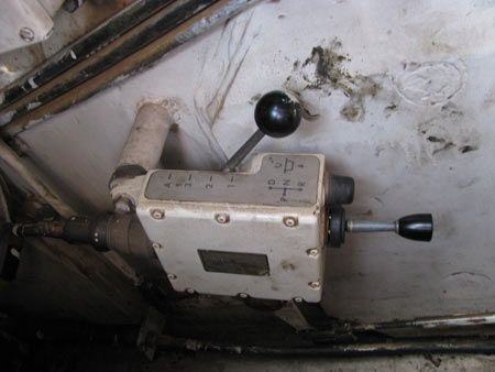 +- And again, if I remember correctly, there was just the brake and accelerator paddle.- When you switch on the tank, its in first gear.- Pic below shows the puny sized gear-shift compared to steel contraption on T-72!- And yes, you blow the horn with your feet.+