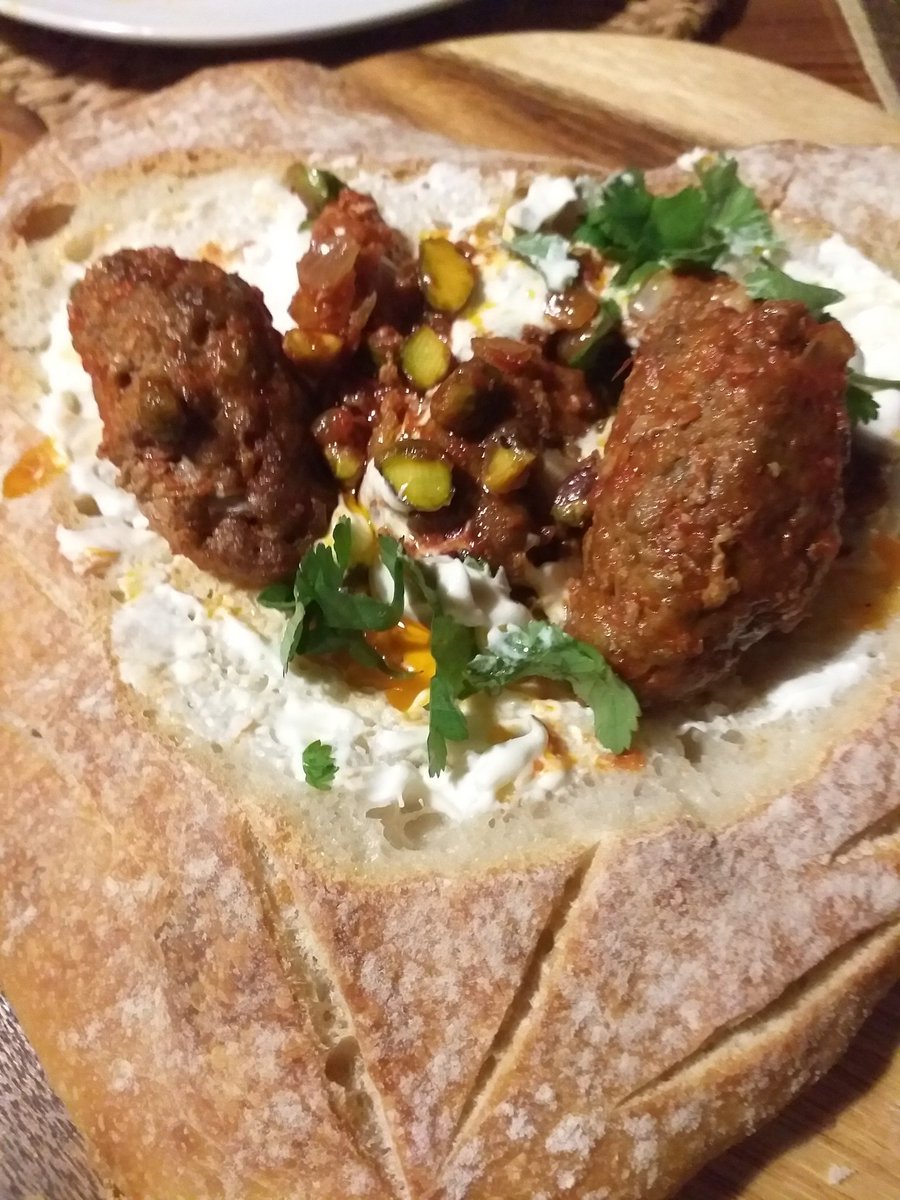Ivycottagebaker's tweet photo. The leftover heart bread from yesterday. Now a Lebanese kofta bil laban treat! And a side of honey & harissa aubergines.Marriage of flavours.Substitute pita for the sourdough & nothing wasted! International cuisine, #madeincumbria #microbakery #notjustbread https://t.co/Y3iVcafIMD