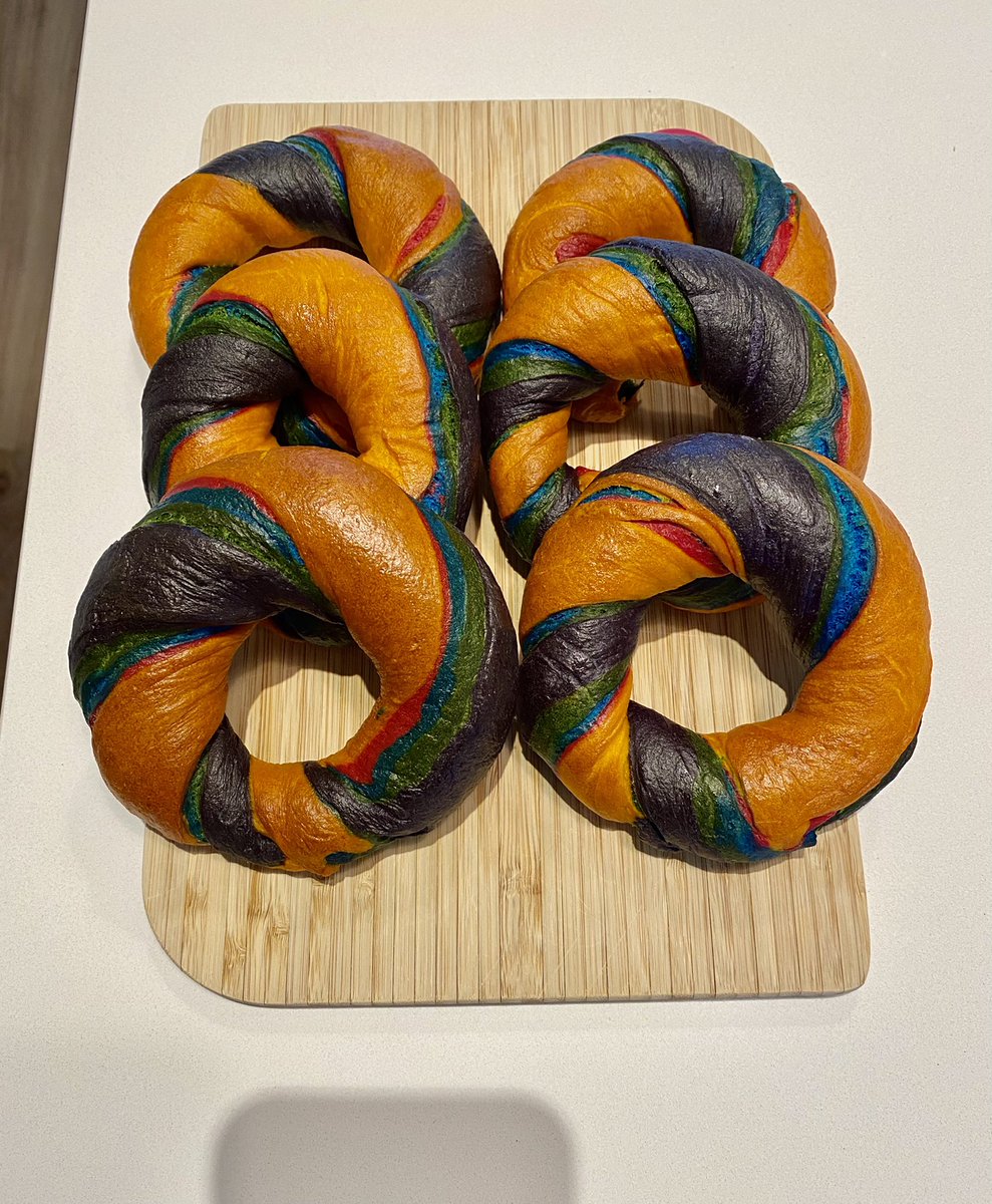 #GBBO #breadweek #Rainbowbagels #GBBOTwitterBakeAlong 
In an attempt not to spend a fortune on new things I used Halloween orange and purple that I already have so a little different to the full rainbow. I did a colourful filling though before it went in my(& @philatreading) tum!