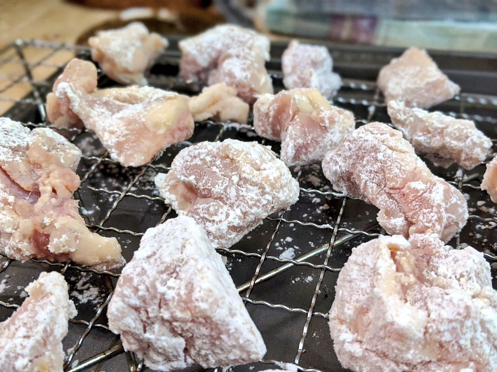 Drain excess liquid, then carefully coat each piece in potato starch with a bit of chicken stock powder mixed in. For extra crunch, dribble a bit of water in before you start + mix to make some tiny chunks that will attach to the chicken.Let sit on a rack for at least 10 min.