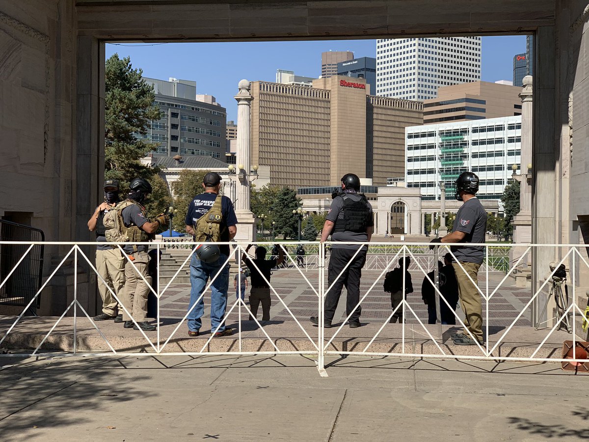 Hello from downtown Denver where far-right militia groups are holding a rally. Far-left Black Lives Matter Antifa groups are holding a counter protest nearby. Lots of police and militia groups out already. Fences seem to be in place to try and separate the groups.  #9News