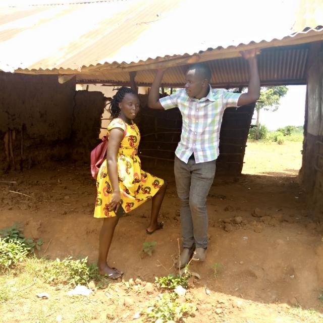 oromakenneth's tweet photo. Most disturbing photo on the internet today @ChebijiraEsther and @Wamalaizo  both @TEACH4UG fellows standing in place of a classroom wall. Esther did this classroom stay standing after you moved away? https://t.co/7u3bBlvSGD