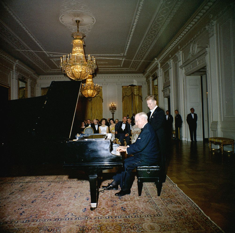 In the following photograph, President Truman plays the piano for guests in the East Room including Eugene List (standing). (7/7)Image Credit: John F. Kennedy Presidential Library and Museum / NARA