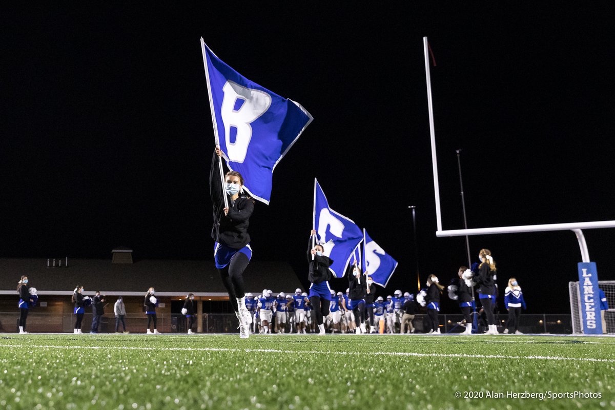 AlanHerzberg's tweet image. Cheerleader and 1st-team All-GMC golfer @EvaKumer leads @BC_lancer_FB on to the field before the start of Friday's game against Catholic Memorial.