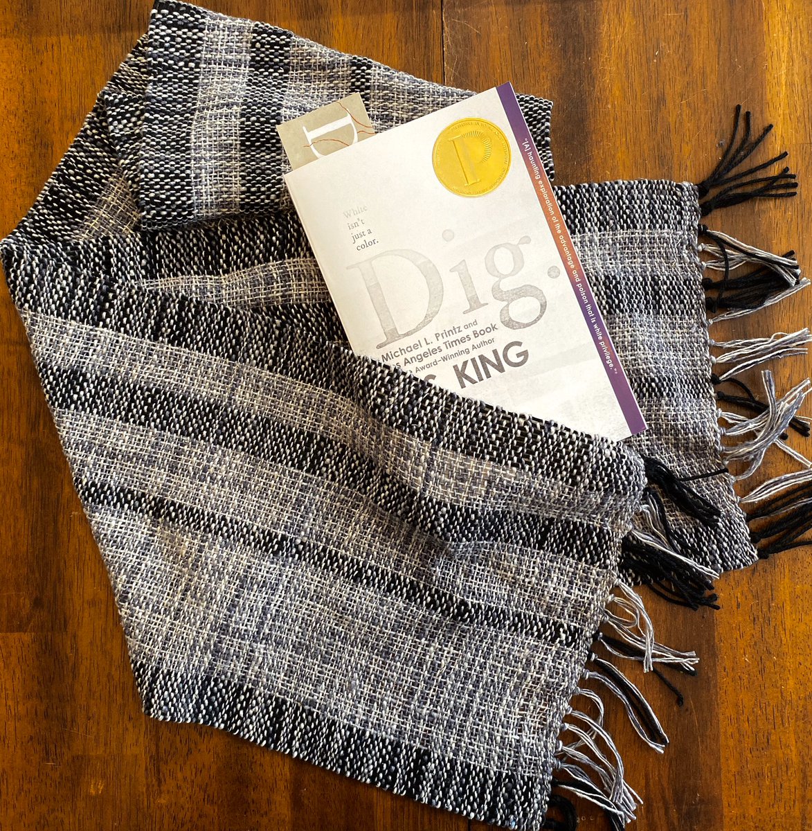 Scarf: silk, 60”x 9.5”, black and variegated gray/natural. Book: paperback, gold sticker on it, signed. Bid now—see my last tweet for how!)  #VoteRidersAuction  @3toVote