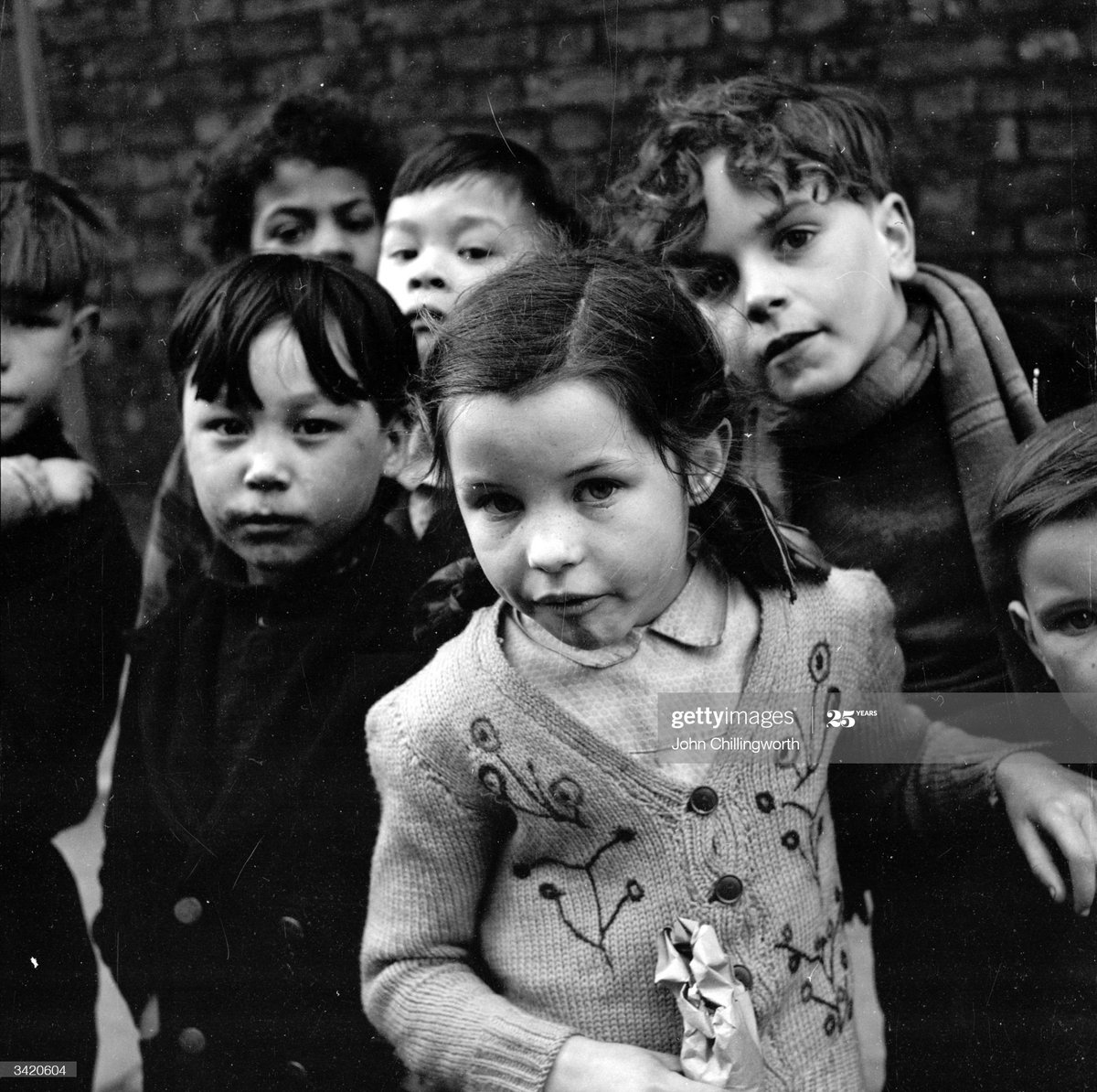 No one is born racist .A group of children playing in the streets of Liverpool, 1954.Photo by John Chillingworth