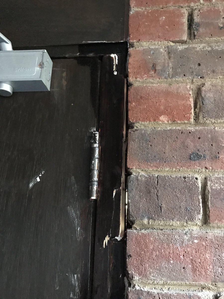 6th problem, Sub-standard repair of fire door in Dodson St. The door jamb is parking chef in with softwood, left unpainted, and has screws which I managed to undo by hand.