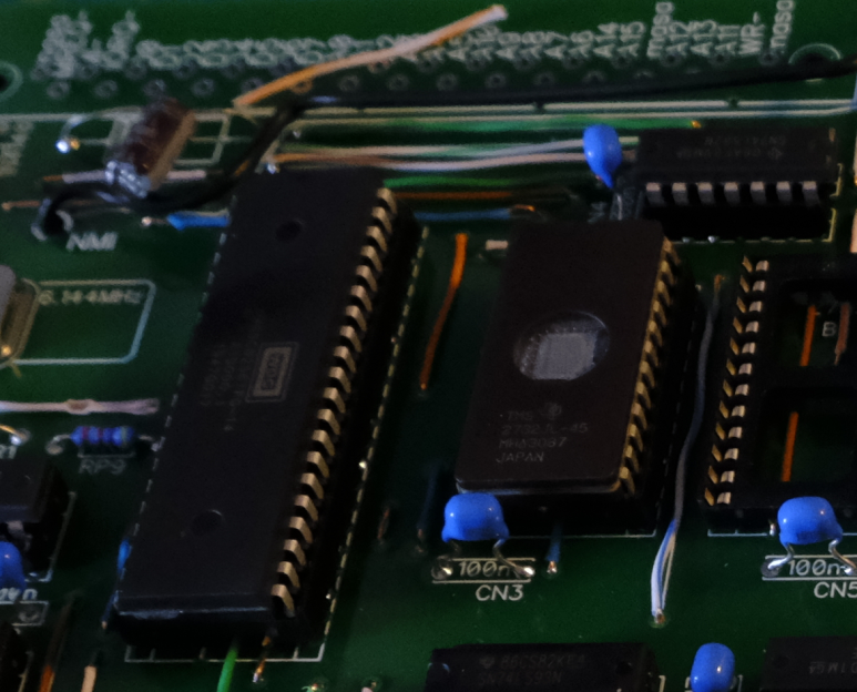 So, Galaksija uses EPROMs for system (OS) storage. EPROMs are Erasable-Programmable ROMs. You need a special EPROM programmer to "burn in" your code, and you can erase them by exposing their little window to UV light. Once you program them, you cover the window. Very cool stuff!