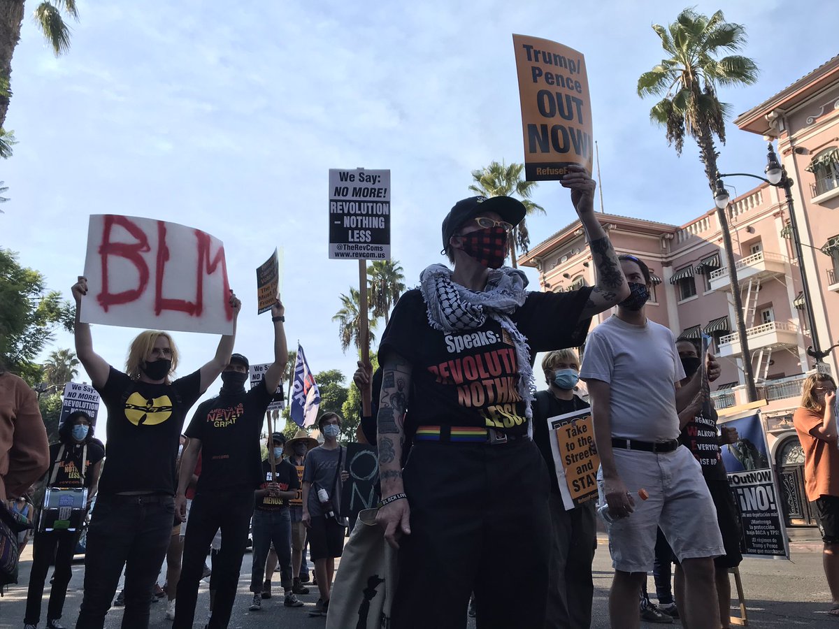 RefuseFascismLA's tweet photo. Marching through the streets of #Hollywood raising the unifying demand of #TrumpPenceOutNow โ We must DEFEAT #OperationMAGA with the power of the people in the streets driving out this fascist regime: #OperationHumanity! @RefuseFascism https://t.co/Cddty5aFxB https://t.co/WivoPhGLB8
