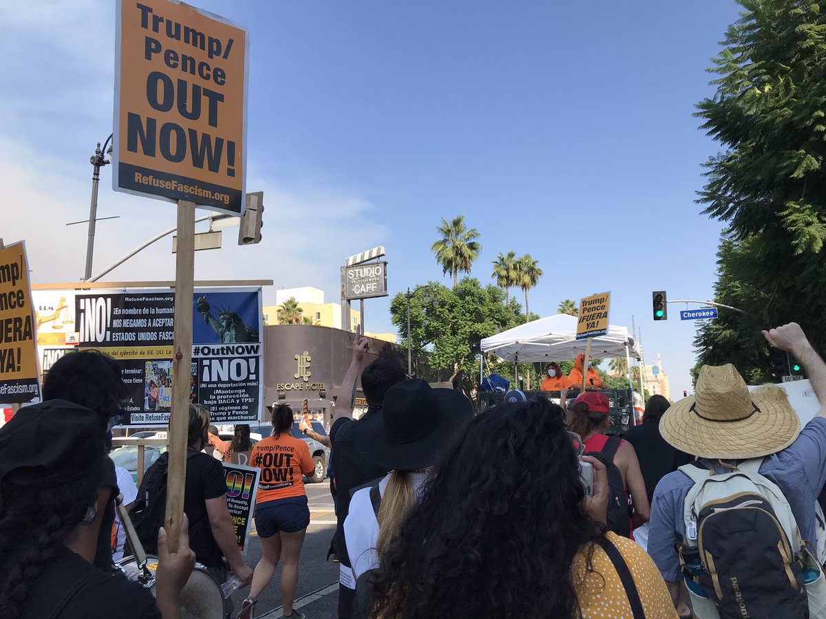 RefuseFascismLA's tweet photo. Marching through the streets of #Hollywood raising the unifying demand of #TrumpPenceOutNow โ We must DEFEAT #OperationMAGA with the power of the people in the streets driving out this fascist regime: #OperationHumanity! @RefuseFascism https://t.co/Cddty5aFxB https://t.co/WivoPhGLB8
