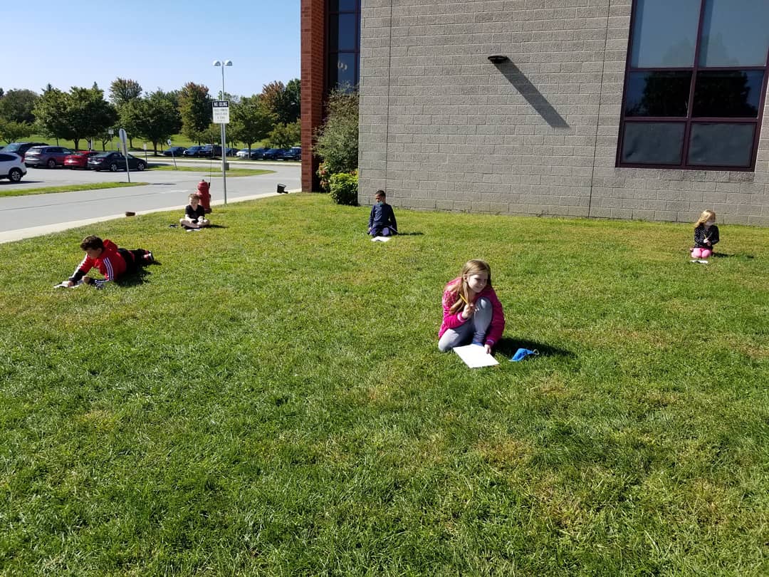Missbertoli's tweet photo. We have been talking about using our 5 senses and thinking about fall! We had a great fall day doing our work outside! #brainstorming #fallwriting @hempfield https://t.co/14pL2K4mSs