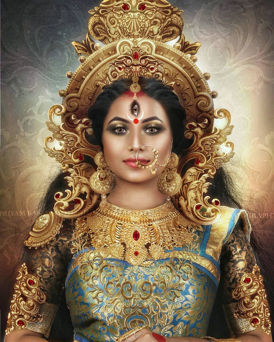 4}At times a devi is represented as having two arms, at other times four arms, and still other times as having eight arms, suggesting that each may effectuate many things. Each devi has a forehead decoration called bindi (tilak), which is a mark between the eyebrows.