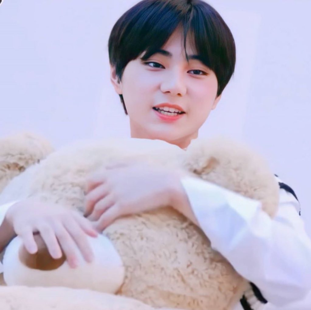 hugging a teddy bear <333