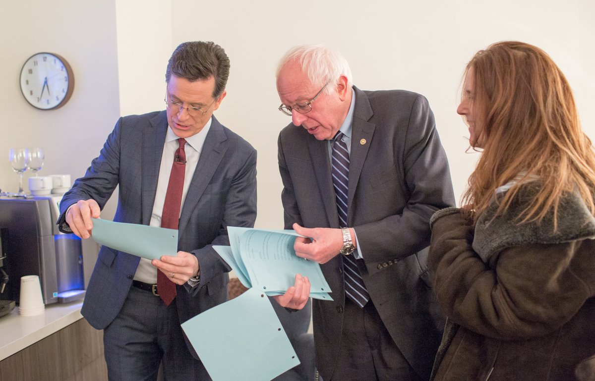 's tweet image. Here's wholesome pictures of @BernieSanders and @StephenAtHome going over a script for your timeline.