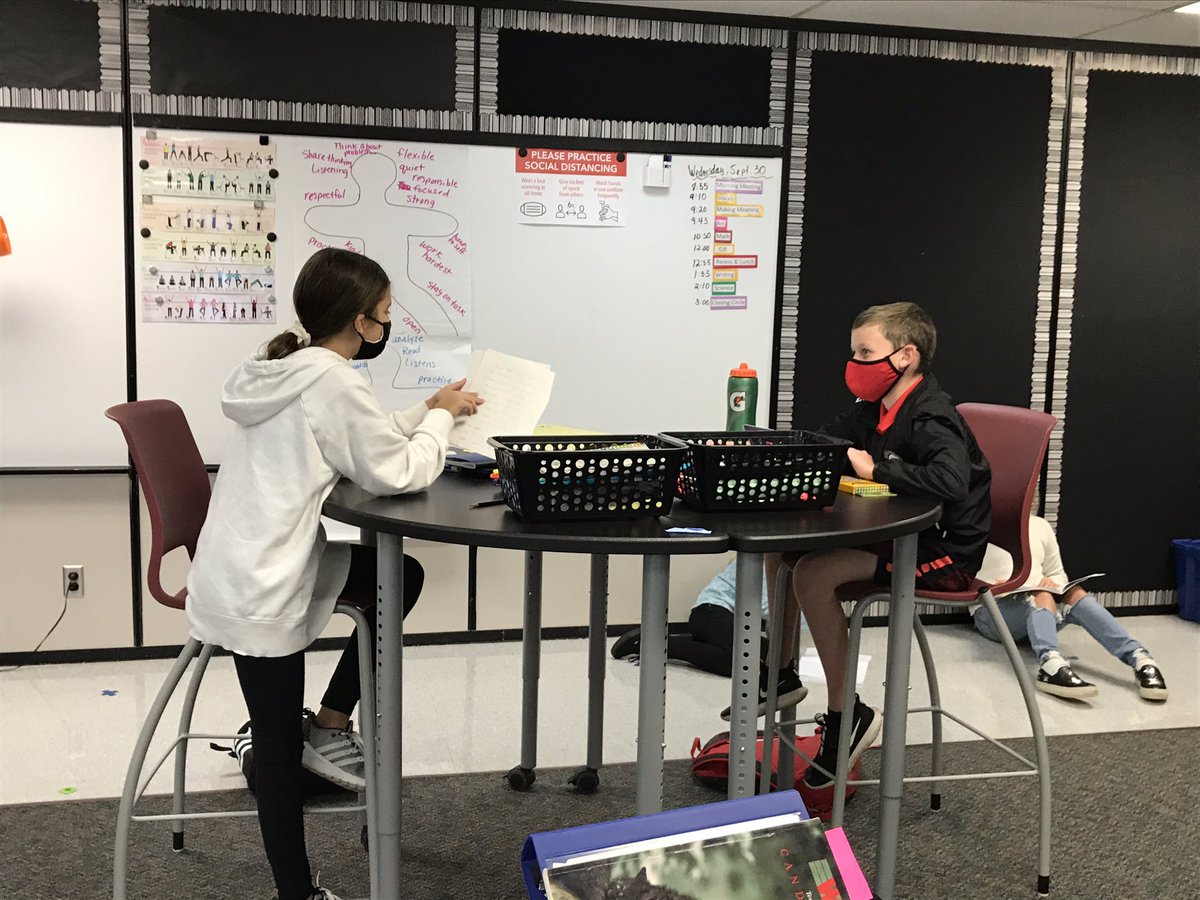 Socially distanced partner writing conferences. Helping each other prepare to publish our first writing piece. #collaboration #communication #makingitwork