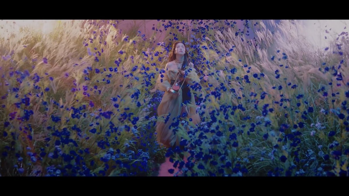 I think is a dream. Jisoo is broken but at the same time the flower scene expressed her drive with staying positive and moving on. Blue flowers are representation of hope and the beauty of things.