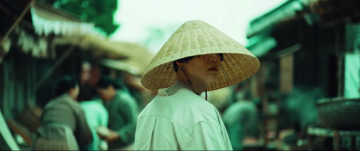 now this is where agust d enters the market place of the kingdom and suddenly a green hue is over the frame because that is agust d’s first interaction with the corruption of the land.