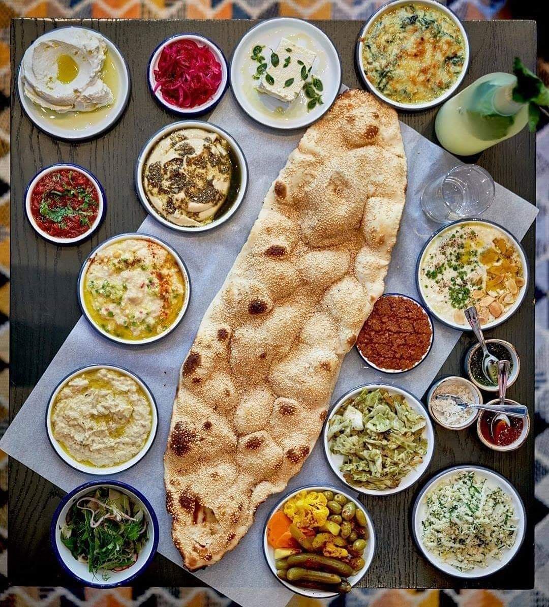 TasteAtlas's tweet photo. 🇹🇷🇮🇷🇱🇧🇮🇱🇸🇾 MEZE PLATTER

Authentic Middle Eastern meze platter: freshly baked Taboon flatbread, also known as #Laffa, and an array of #MiddleEastern #dips - #Hummus, #BabaGanoush, #Mastokhiar, #Acılıezme, #Muhammara, #Moutabal, #Labneh... 
📷 @instagram.com/noleftovers https://t.co/zrUe6br74Y