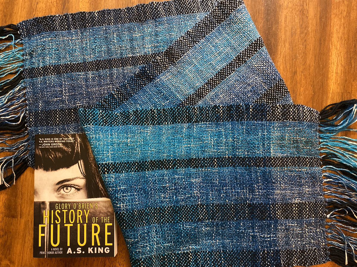 Lot #2 for  #VoteRidersAuction (scroll up for bidding info) Scarf: cotton/acrylic blend, 55”x11”, variegated blues, teals, black. Book: paperback, involves ingesting bat dust and a narcissistic megalomaniac, signed. Bid now!  @3toVote