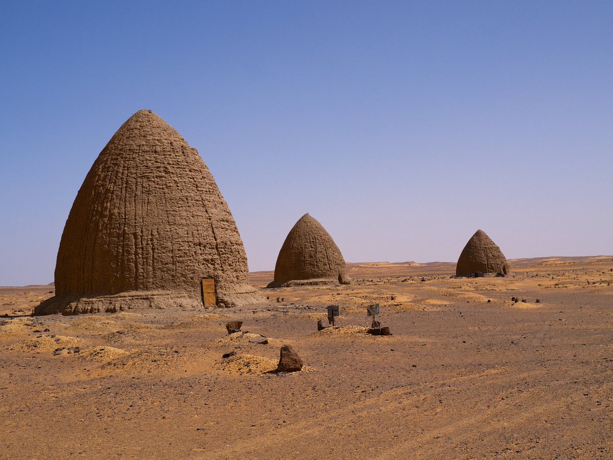 Sudan: The domed/qubba tombs of the medieval city Old Dongola in northern Sudan, built as a Muslim cemetery during the Funj era in the 1600s after the city's Nubian inhabitants had largely converted from the formerly Christian kingdoms.