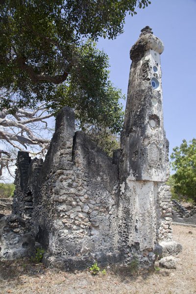 Tanzania: One of the distinctive Swahili coast "pillar tombs" in a Muslim cemetery in Kunduchi, with this one dated to the 1600s I THINK - spot the Chinese porcelain bowls embedded in the pillar!