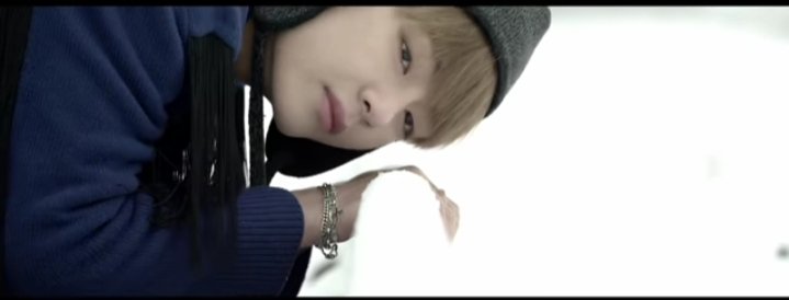 In the 1st scene,Taehyung stands alone at a train station,putting his ear to the tracks to listen for an oncoming train. Shots of him in the snow showcases the emptiness of the station which also represents loneliness. This is similar to the film "INCEPTION" where +++