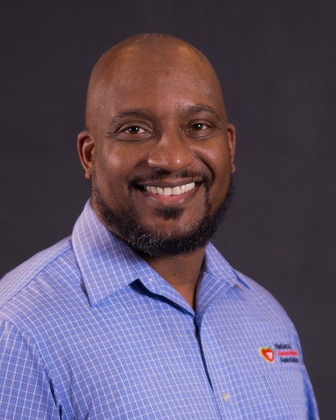 Rev. Orlando Scott smiling at camera. 
