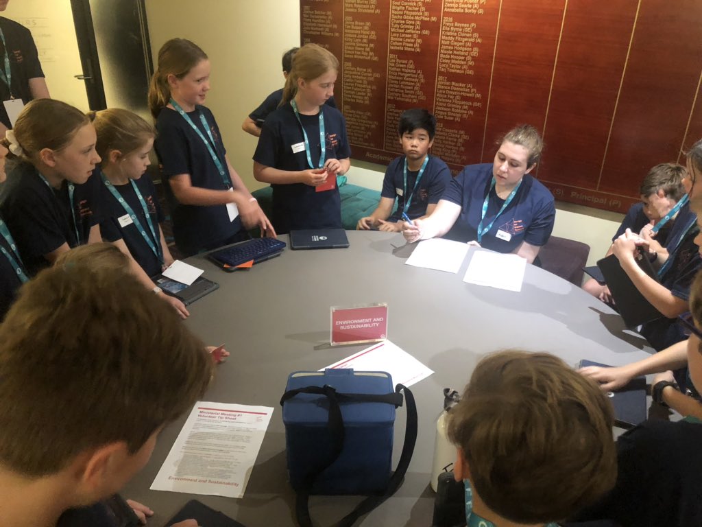DFISummit's tweet photo. Students have selected a portfolio to manage in their teams. Now representatives from each team are meeting together for a ministerial meeting. Their objective is to create a mission statement for the mayor.  #DFISummit2020 #DesignThinking https://t.co/oq1m5KCNgl