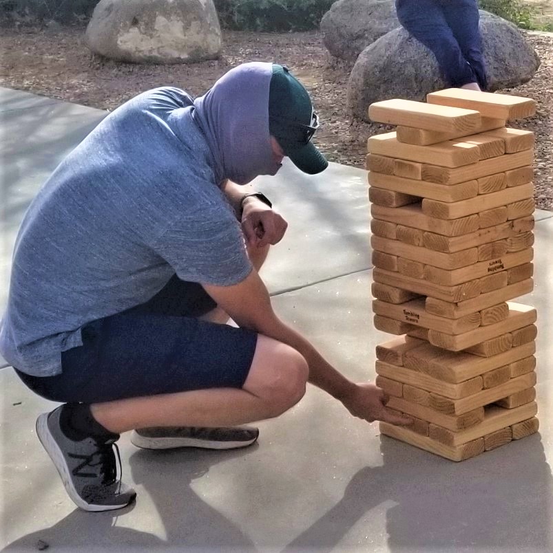 <a href="/apexeval/">Apex Evaluation</a> came together last Friday for a socially-distanced good time at High Desert Park, caught up on life, and engaged in some friendly competition. Here Neil Greene, @CarlosApex, and Mitch Herz problem-solve with giant Jenga.