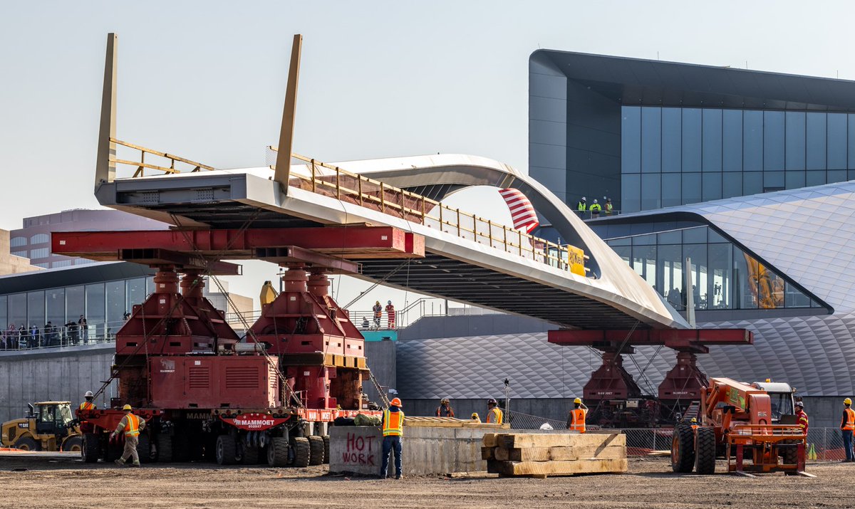 OlympicCityUSA's tweet photo. Today, crews moved the 1.1. million pound pedestrian bridge over 11 railroad tracks in an 8-hour window. 

To do this, 1.5 million lbs. of timber and 405,000 lbs. of steel were needed to create a crossing path and eight 250-ton mega jacks were used to hoist it 22 ft. in the air. https://t.co/fsaZtpcf3P
