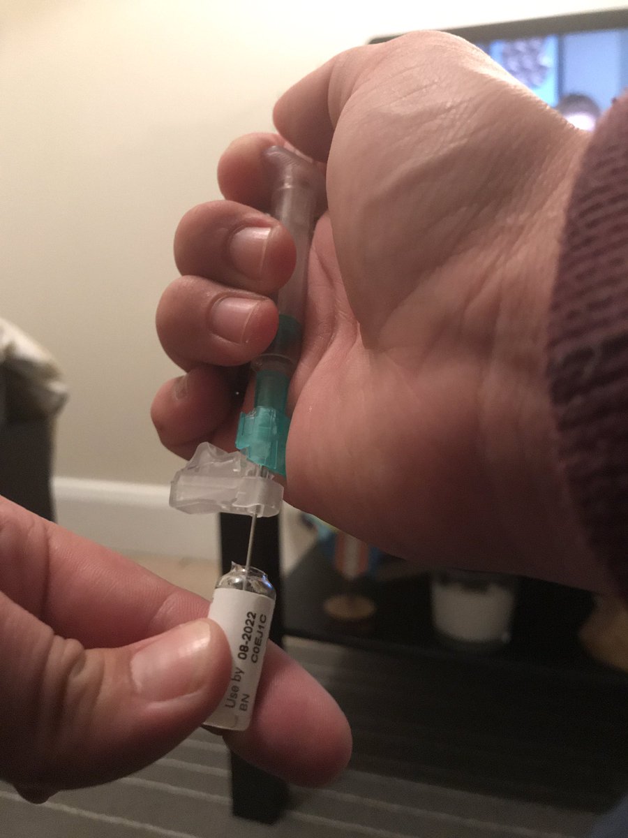 I begin to draw the medication up into the syringe very slowly because the consistency is so thick.