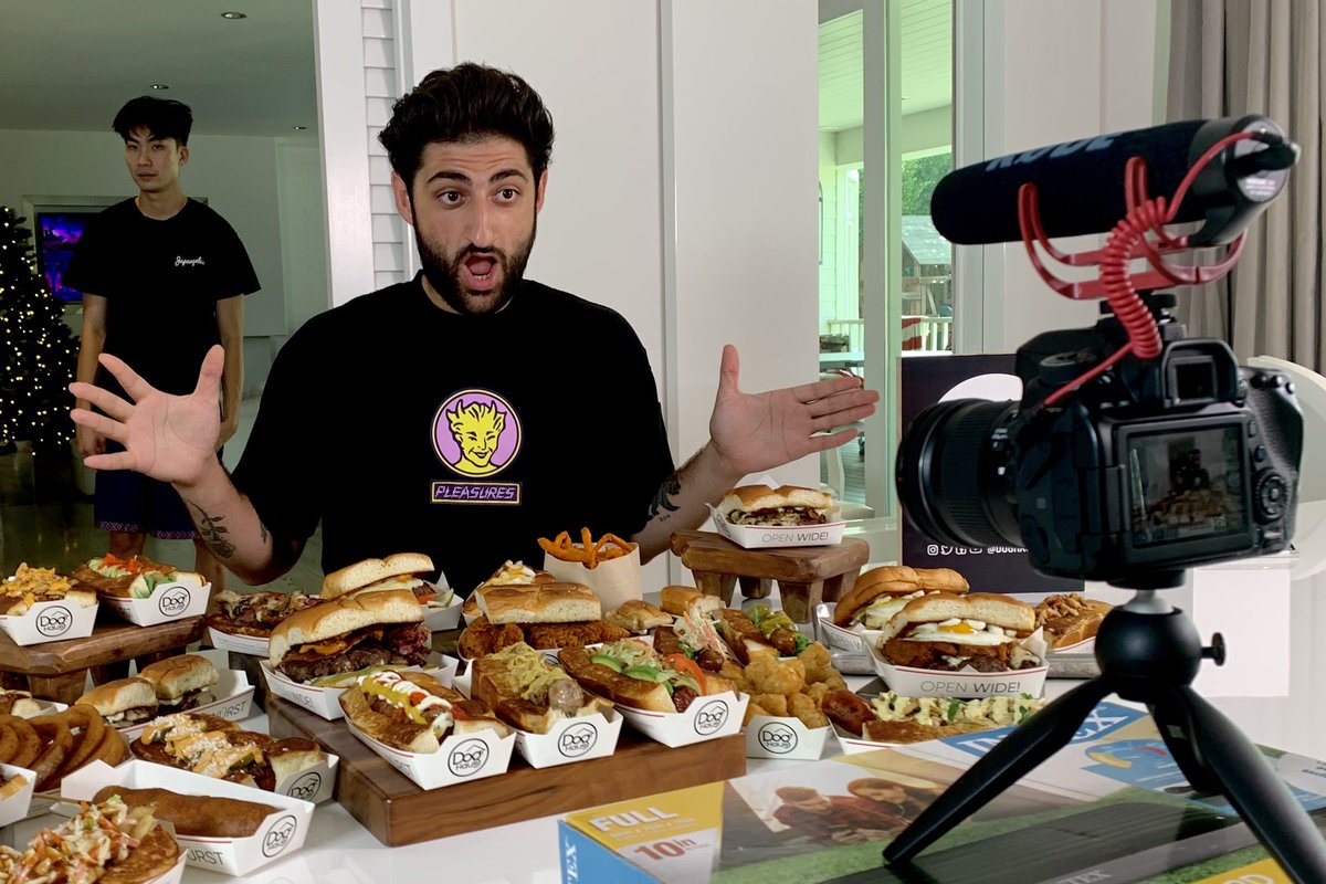 DogHausDogs's tweet photo. When @faZeNikan says he wants to taste test the entire menu... #ChallengeAccepted 🌭🍔🍟 #faZeclan #faZeup https://t.co/2bZALVcpid