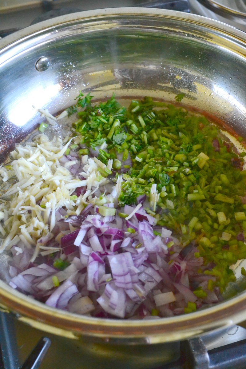 Sasa we begin bringing everything together.The base is really herby which makes for a solid foundation to build flavor from. In my pan: red onion, dania stems and garlic 