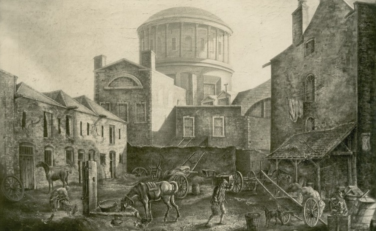 This is an illustration of the rear of the Four Courts prior to its compulsory acquisition, showing the stables of the White Cross Inn. The Four Courts nearly burnt down after a fire broke out here in 1805.  https://ruthcannon.com/2020/06/12/fire-in-the-four-courts-1867/