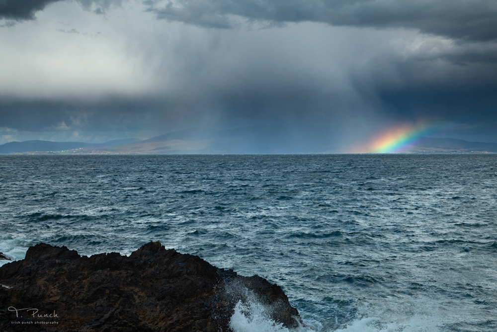 TrishPunch's tweet photo. When you listen to the weather forecast and hear that there will be isolated showers, it doesn't sound too bad until you get caught in one! 
Rainbow and a small shower in Clew bay in Mayo. https://t.co/17nr33goAH