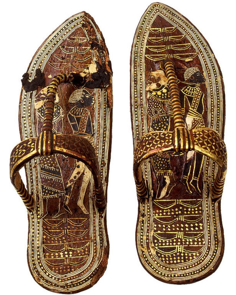 As a form of humiliation, the king depicted his libyan, asian, and nubian enemies on his staff, his leg rest, and his slippers, so everytime he steps a foot, it is as if he is stepping on his enemies.