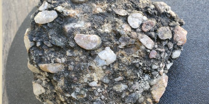 A sample of pebbly rock that researchers took from an outcrop in Nunavut. The rock was found to contain both gold and diamonds—a rare combination similar to that found in the world's richest gold deposit in South Africa. (Photo: Supplied)