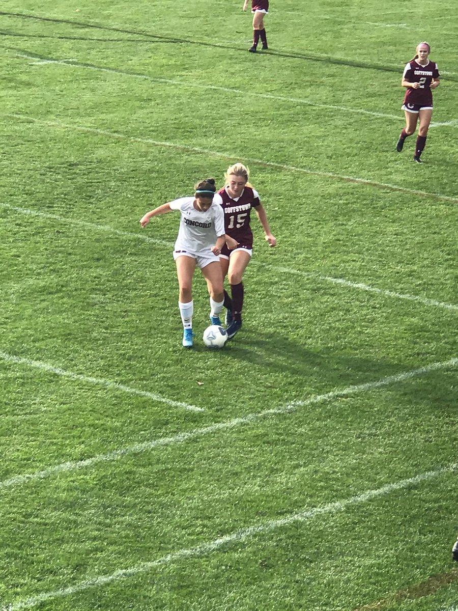 GHSSPORTS21's tweet photo. Kristen Nanof fights for the ball with a Concord player in NHIAA girls soccer action from Goffstown this afternoon. https://t.co/Q7iV33ymXC