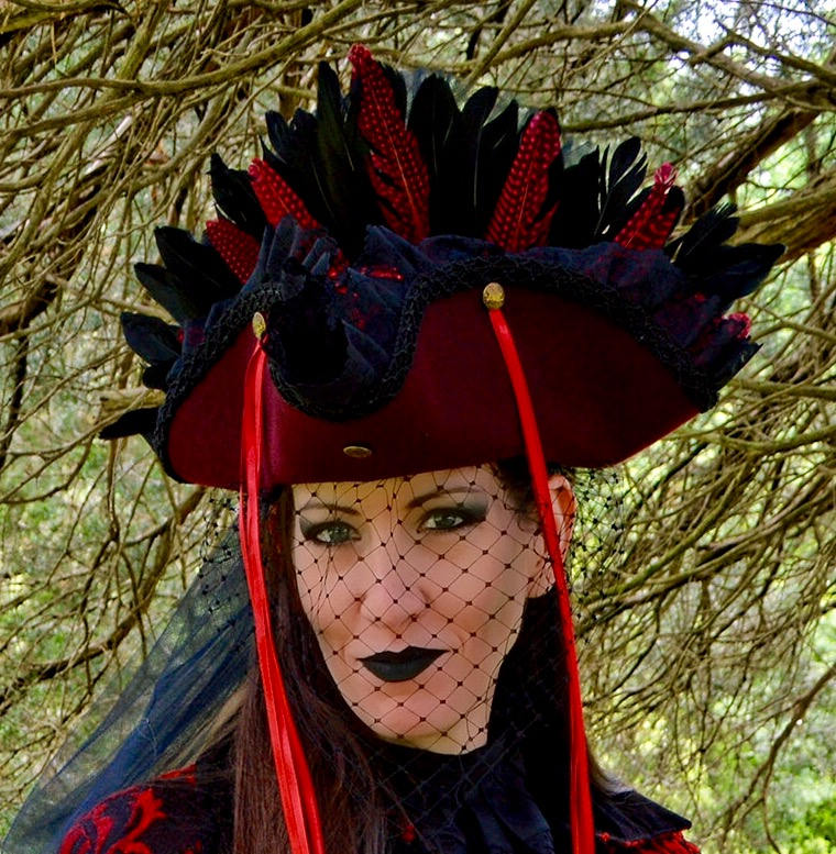 Occasionally, she might add some lacing on top of the dome of the hat or throw on netting to wear as a veil, if the situation calls for a veil (such as at a funeral.) But these are usually reserved for special occasions.