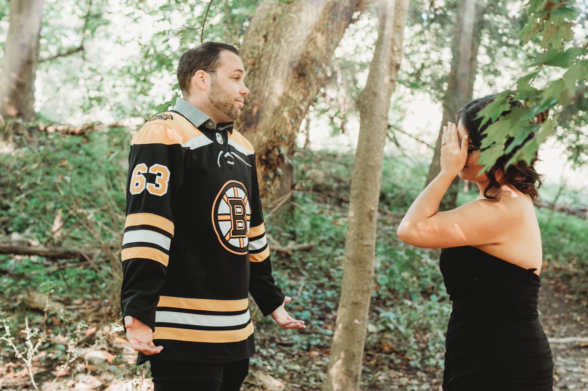 Just_teesingyou's tweet photo. Thanks @NHLBruins for ruining my engagement shoot. I asked my fiancé to wear something that matched my black dress and he showed up in a jersey. https://t.co/Wxl1wK5nes