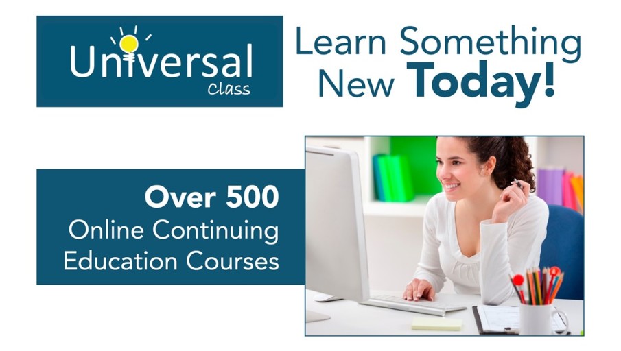 a woman sitting at her desk in front of a laptop smiling at the screen