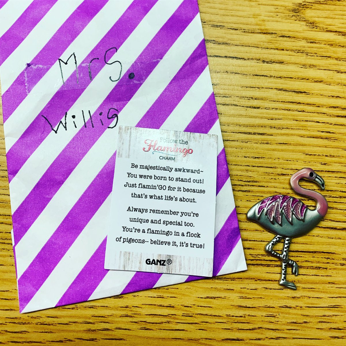 WillisTeach's tweet photo. Yesterday I was given this beautiful flamingo charm & card. ❤️ 🦩 The phrase #majesticallyawkward really stuck with me. It’s amazing to be back together & a bit awkward as we learn new procedures. We’re embracing & learning to do the flamingo steady balancing act together. 🦩 https://t.co/l1fQ6tshTe