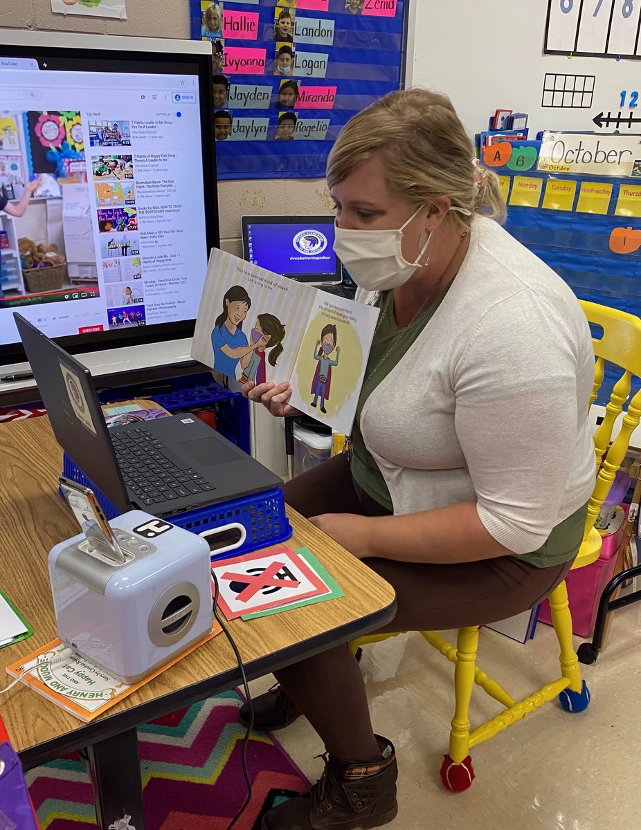 AYCOCKSCHOOL's tweet photo. Nurse Angela Preddy joins Mrs. Smith’s kids during their zoom today to read aloud and talk about masks. We are thankful to have such a wonderful nurse who interacts with the kids, and supports our families and staff! You rock Mrs. Preddy! @borntoteachk @AYCOCKSCHOOL #weareaycock https://t.co/SjZeYEVXKO